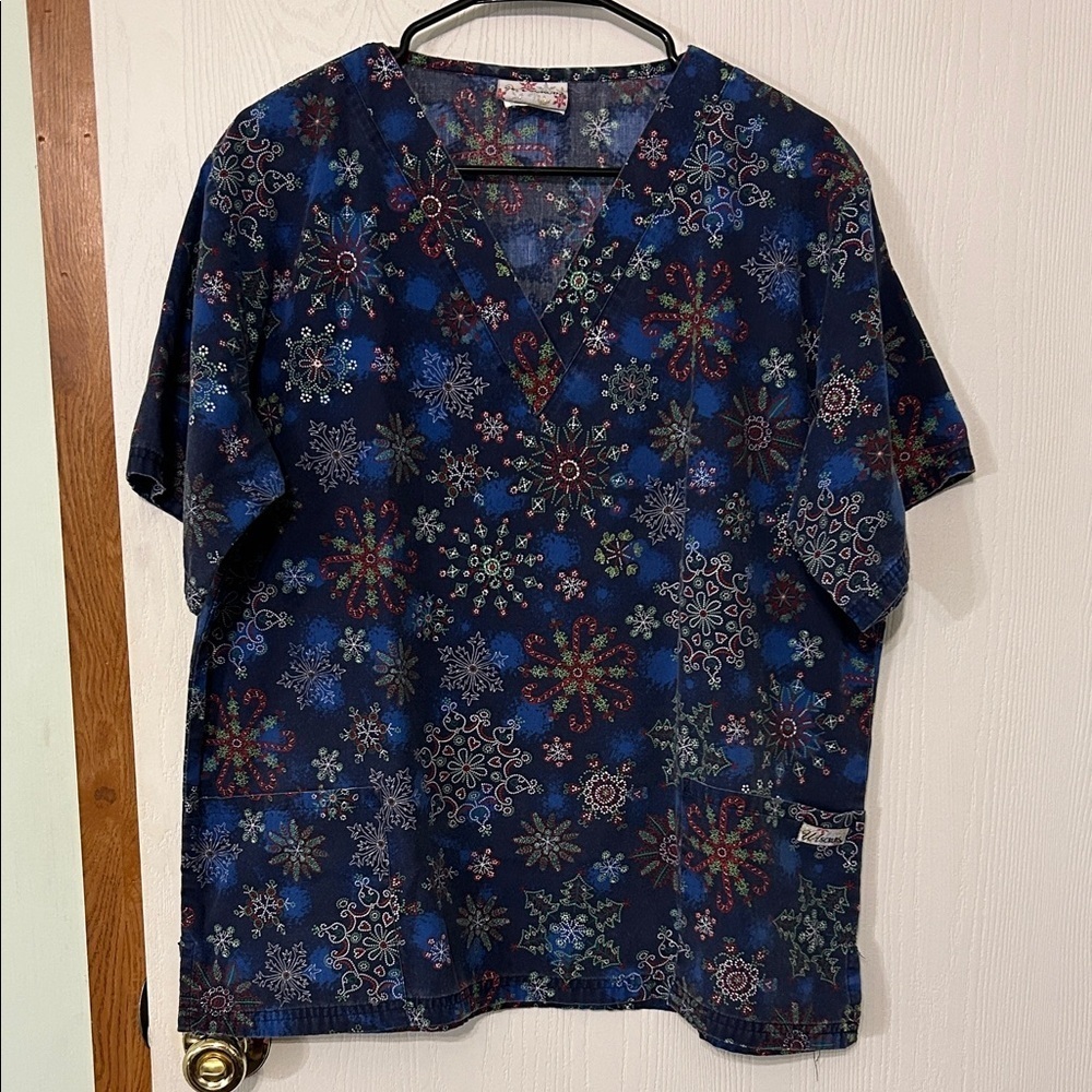 U A Scrubs Navy Blue Holiday Snowflake Patterned Scrub Top PTP 24-1/2”